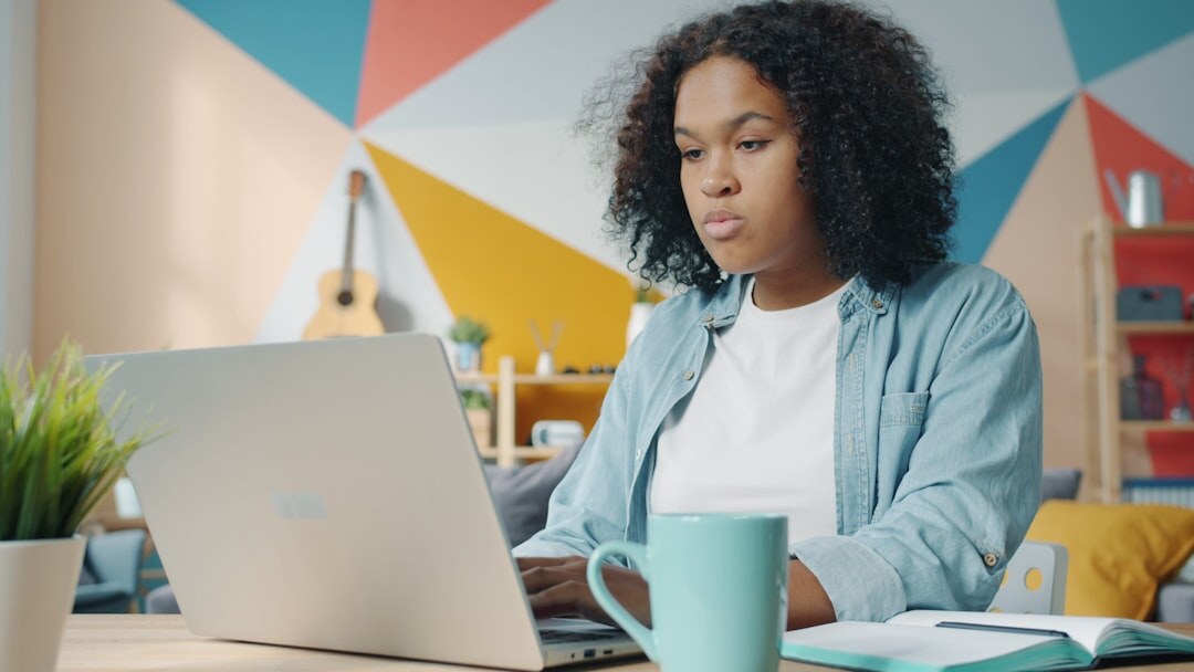 Student studying online course on laptop