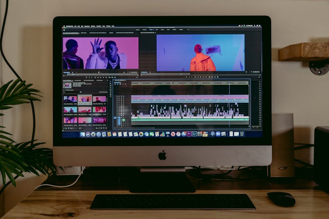 Video editor working on professional editing software on dual monitors